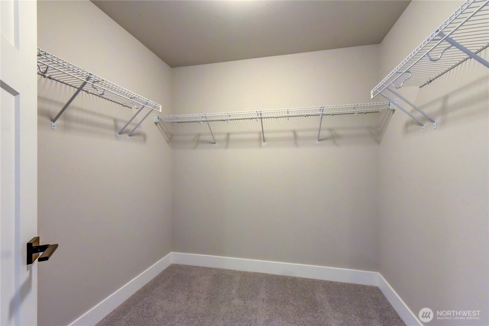19220 Meridian Drive Southeast, Unit CW 08 Bothell, WA 98012 - Photo 20 of 33 a view of a room with racks on the wall