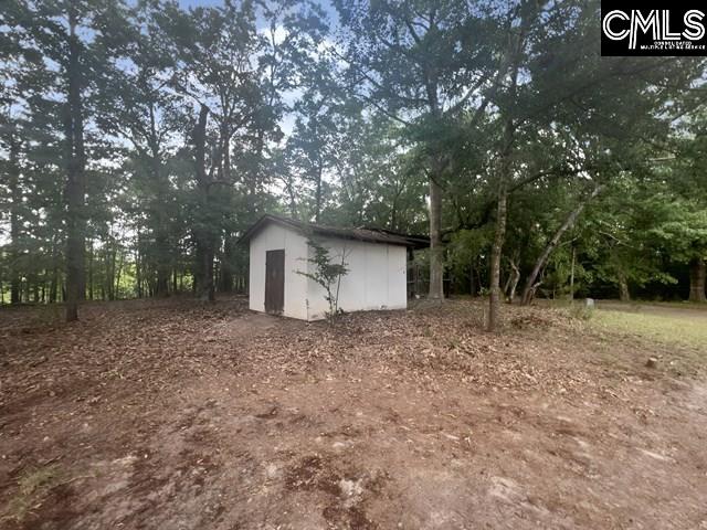 5545 Pisgah Road Rembert, SC 29128 - Photo 5 of 26 a house with trees in front of it