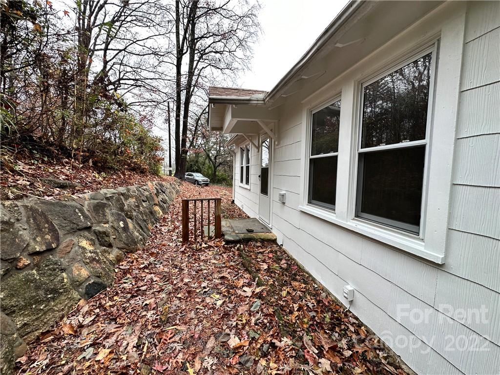 133 Lockhart Road Tryon, NC 28782 - Photo 3 of 17 a front view of a house with a large window