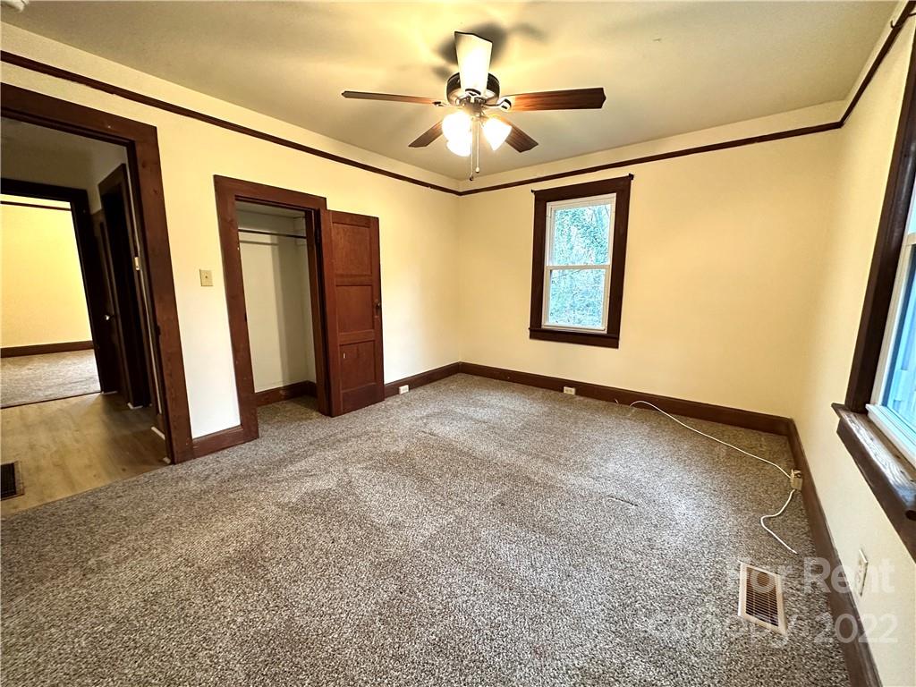 133 Lockhart Road Tryon, NC 28782 - Photo 7 of 17 a view of livingroom with hardwood floor and hallway