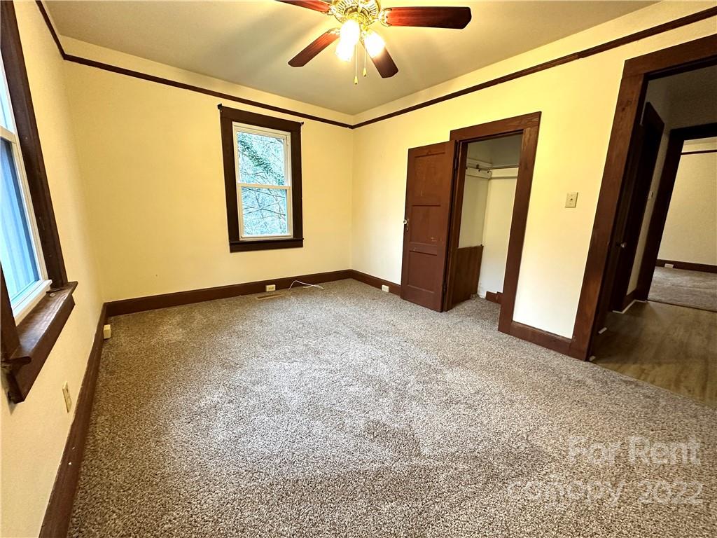 133 Lockhart Road Tryon, NC 28782 - Photo 8 of 17 a view of an empty room with a window