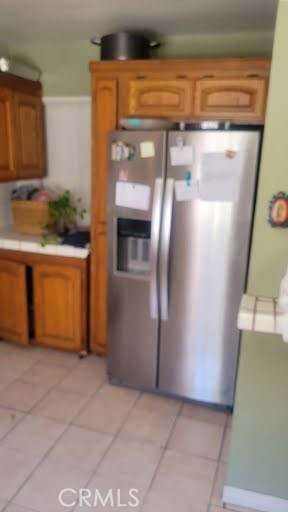 10471 Haddon Avenue Pacoima, CA 91331 - Photo 17 of 23 a view of a refrigerator in kitchen and an empty room