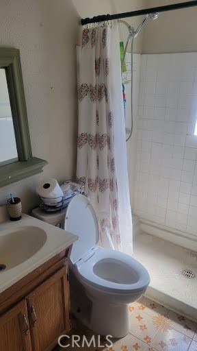 10471 Haddon Avenue Pacoima, CA 91331 - Photo 22 of 23 a bathroom with a sink toilet and shower