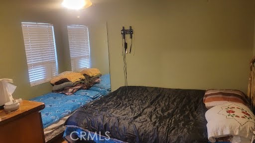 10471 Haddon Avenue Pacoima, CA 91331 - Photo 8 of 23 a bedroom with a bed and dresser