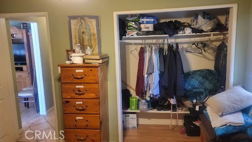 10471 Haddon Avenue Pacoima, CA 91331 - Photo 9 of 23 a view of walk in closet with clothes and shoes
