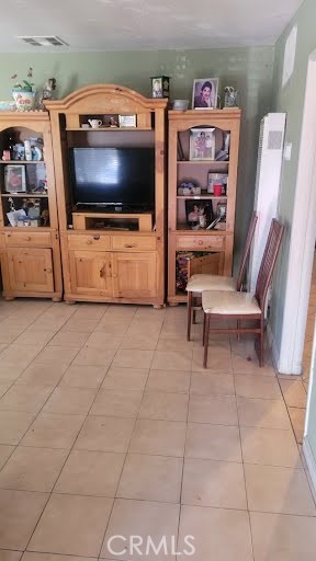 10471 Haddon Avenue Pacoima, CA 91331 - Photo 10 of 23 a living room with furniture and a flat screen tv