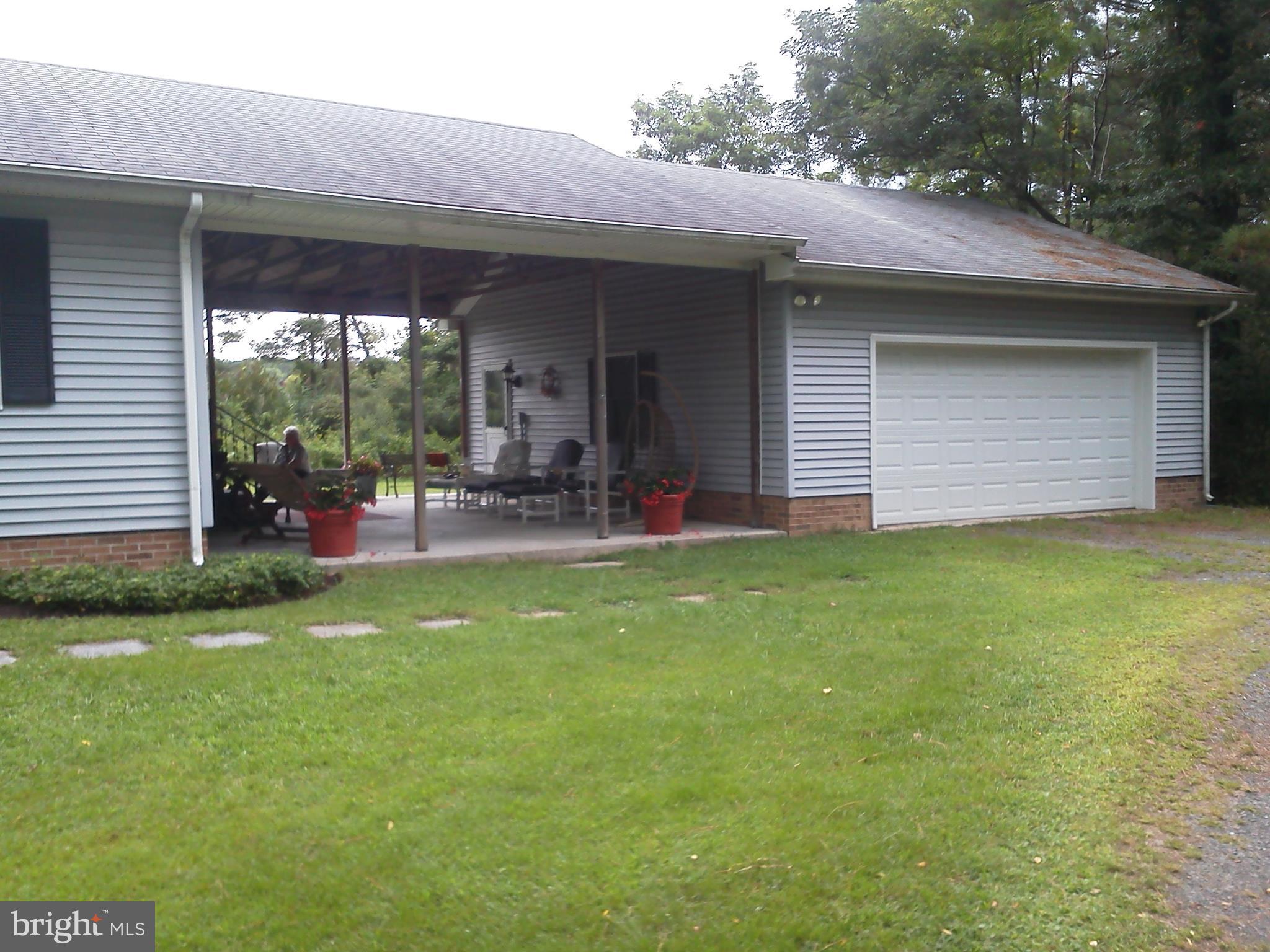 1811 Perseus Road Cambridge, MD 21613 - Photo 14 of 52 Breezeway and garage