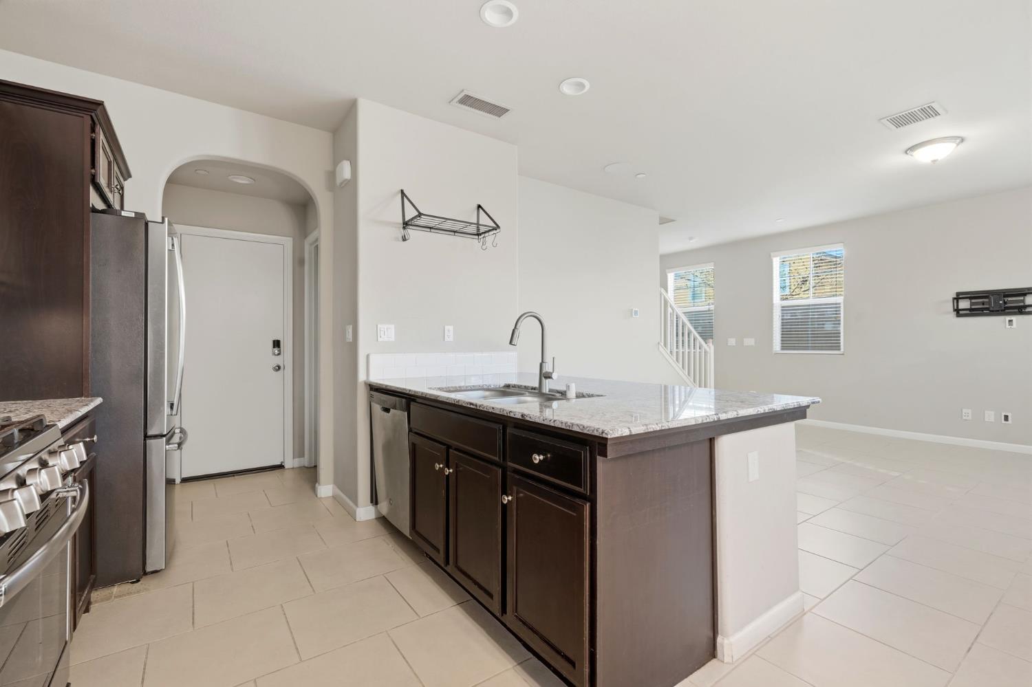 1515 Zenith Clovis, CA 93619 - Photo 14 of 41 a kitchen with a sink and a stove top oven