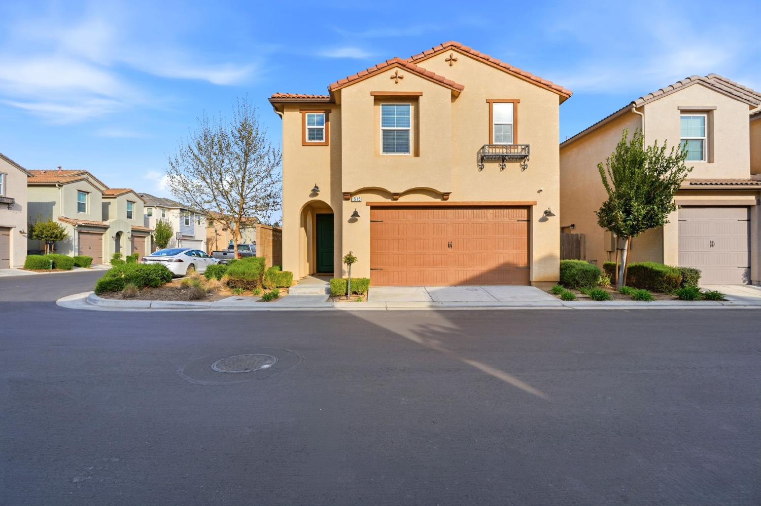 1515 Zenith Clovis, CA 93619 - Photo 2 of 41 a front view of a house with a yard and a garage