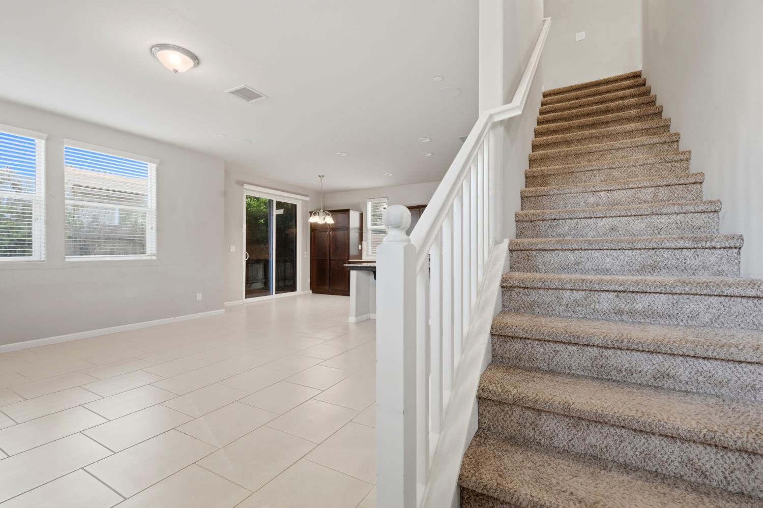 1515 Zenith Clovis, CA 93619 - Photo 21 of 41 a view of staircase with white walls and windows