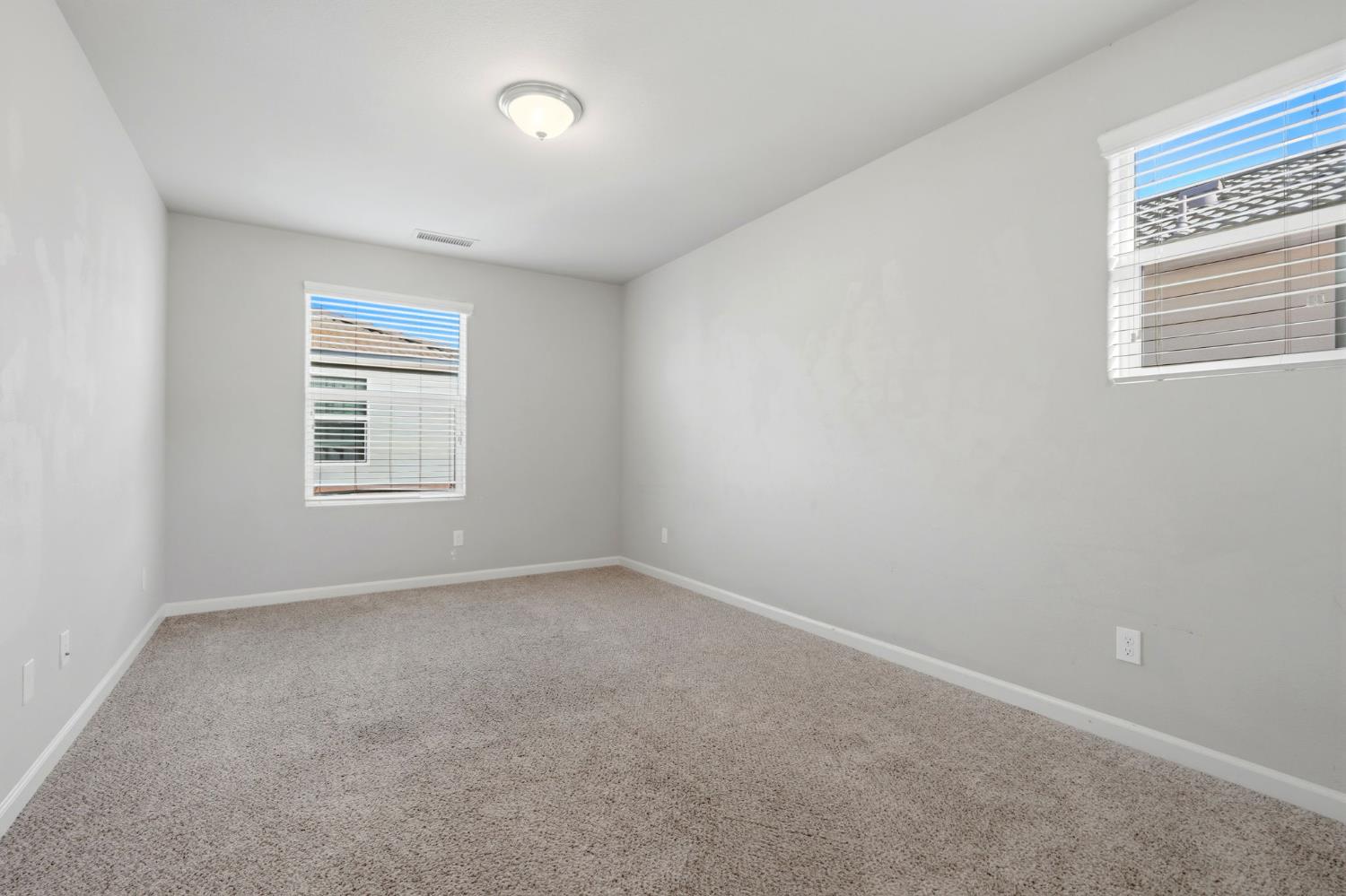 1515 Zenith Clovis, CA 93619 - Photo 22 of 41 an empty room with a window