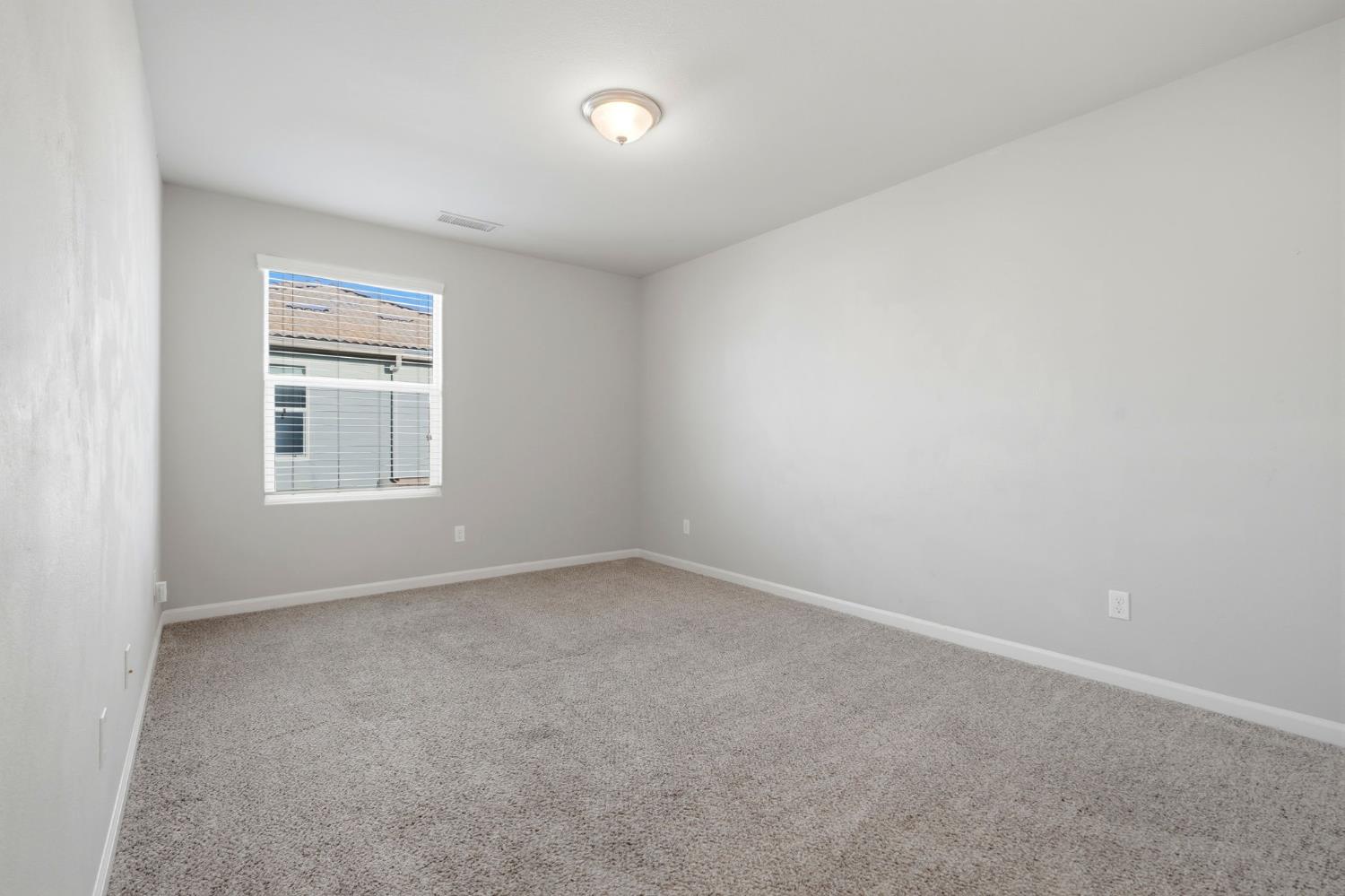 1515 Zenith Clovis, CA 93619 - Photo 26 of 41 an empty room with a window