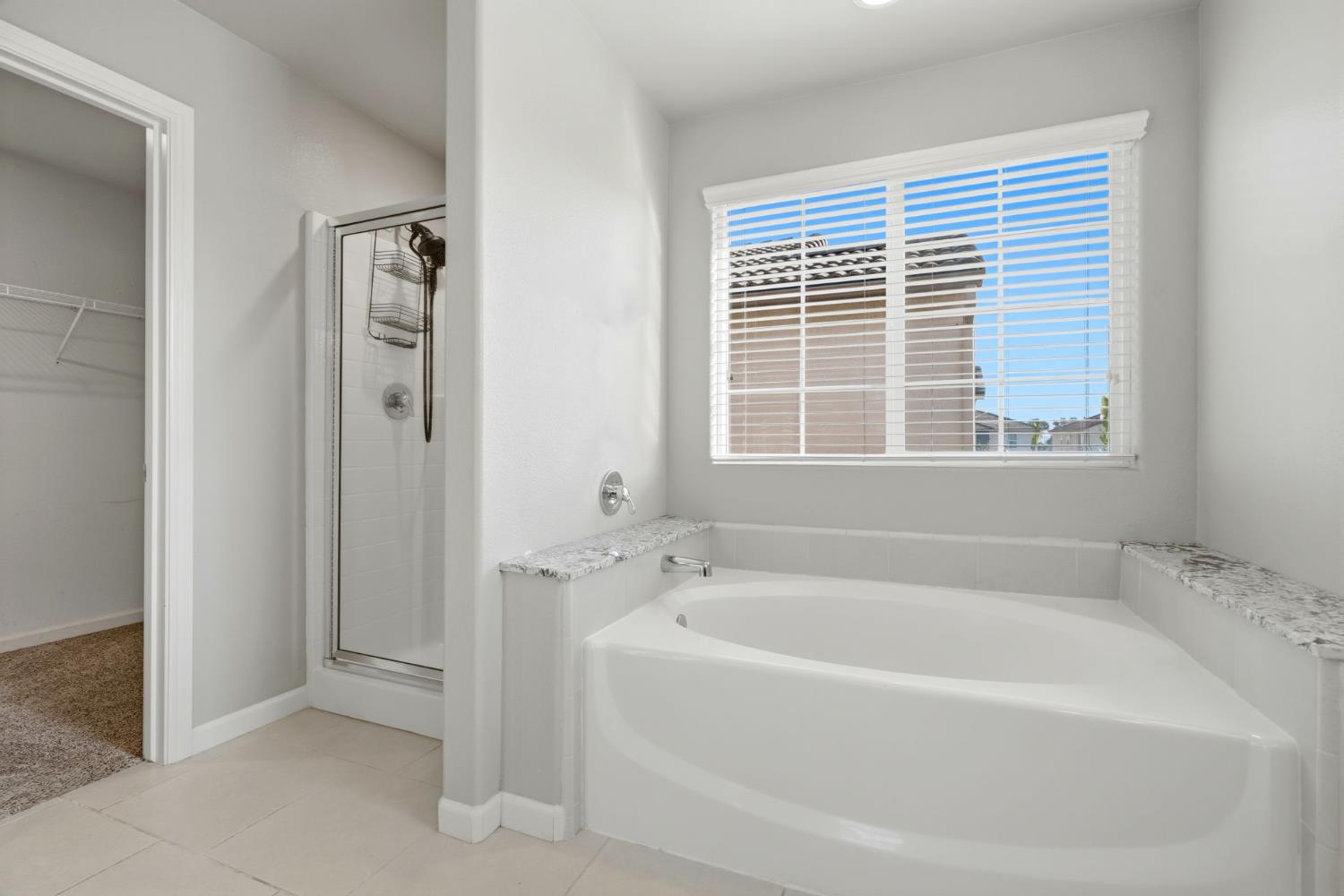 1515 Zenith Clovis, CA 93619 - Photo 36 of 41 a white bath tub sitting next to a window