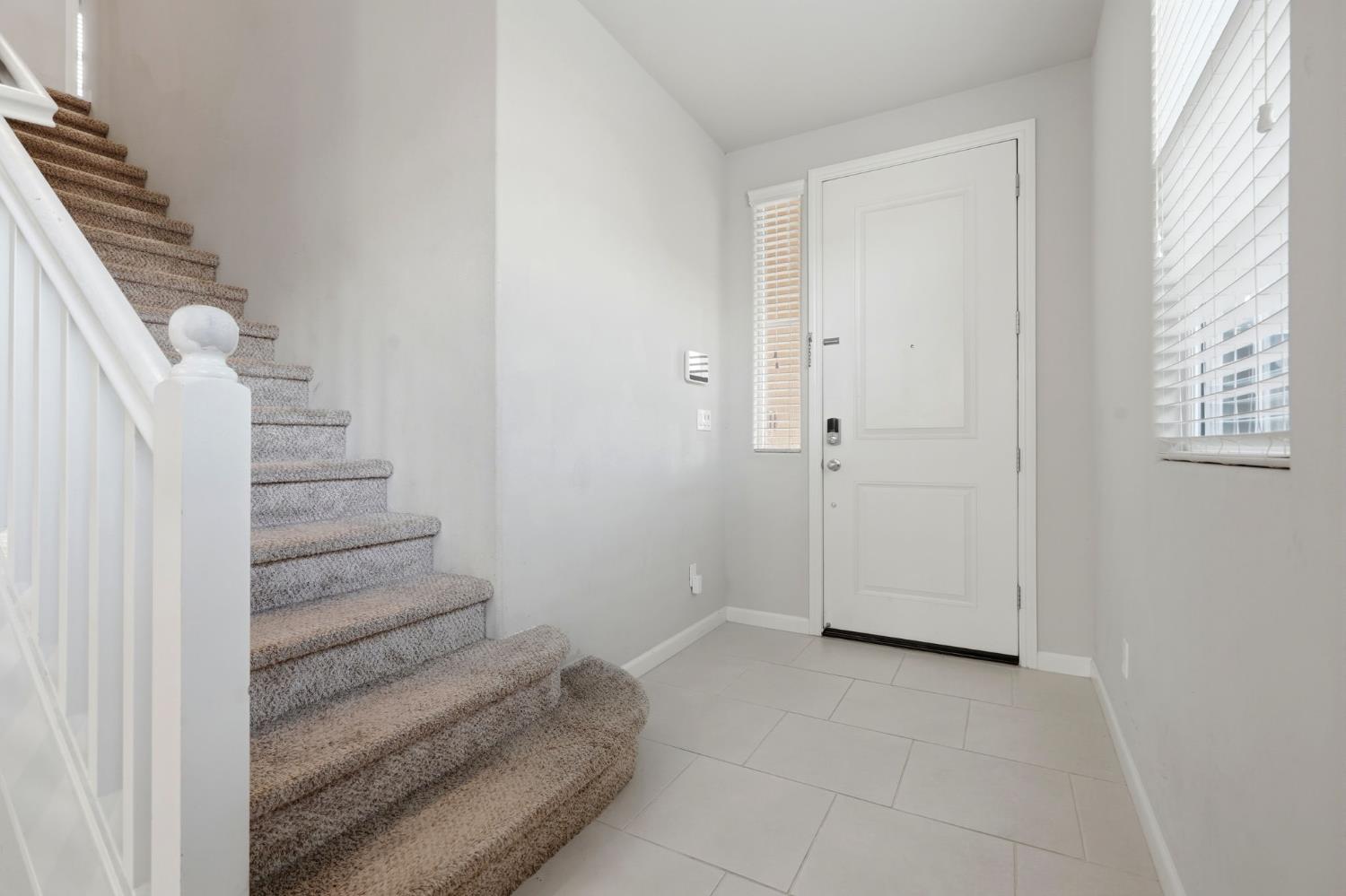 1515 Zenith Clovis, CA 93619 - Photo 7 of 41 a view of entryway with stairs and white walls
