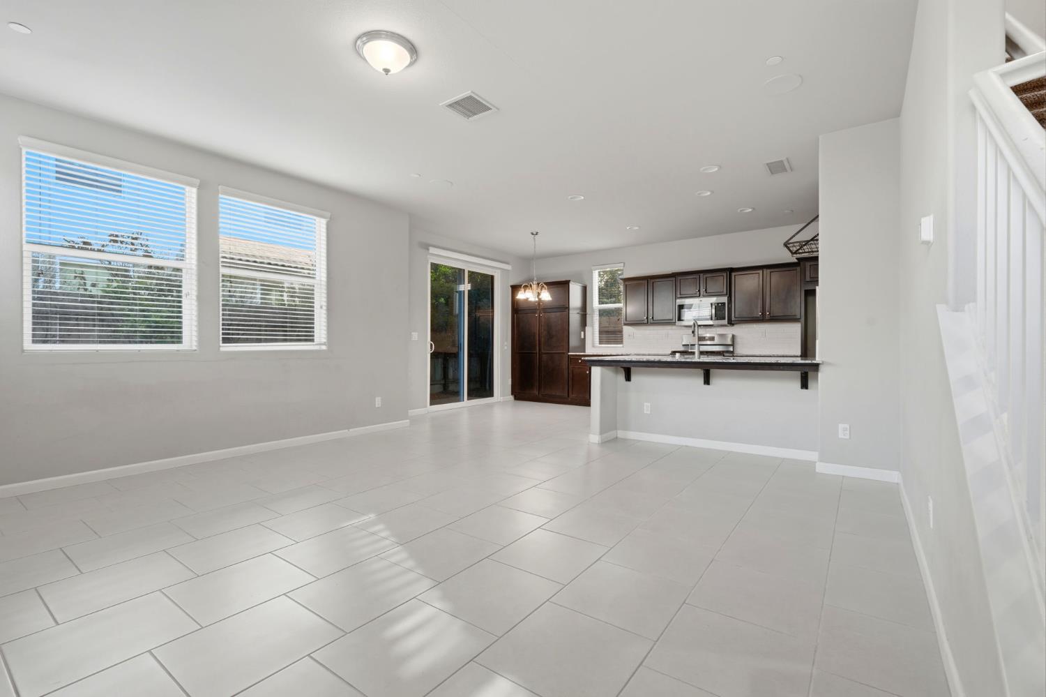 1515 Zenith Clovis, CA 93619 - Photo 8 of 41 a view of an empty room with a kitchen