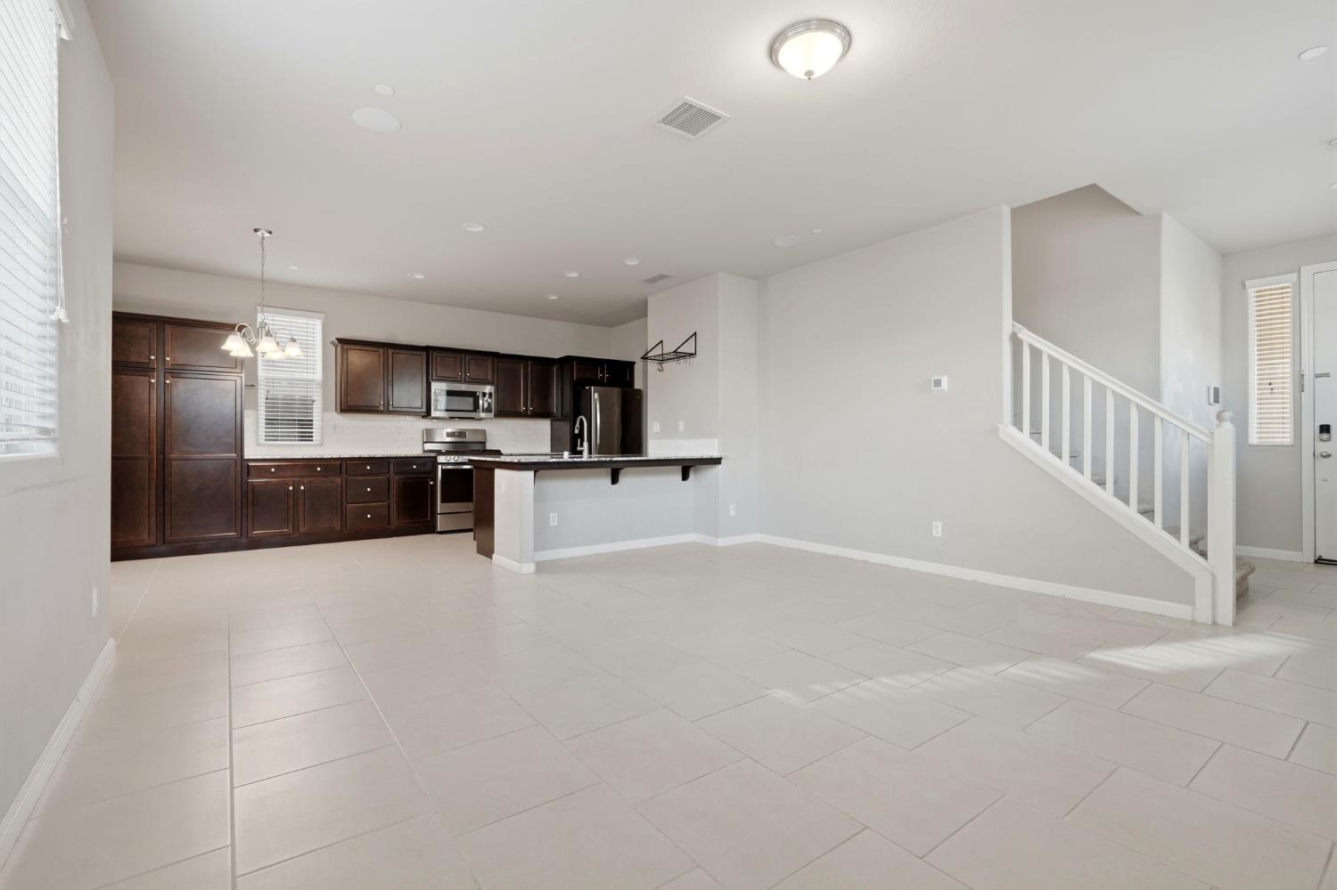 1515 Zenith Clovis, CA 93619 - Photo 9 of 41 a view of a kitchen with a sink and an oven