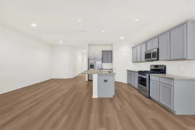 a view of a yard in front of a house with a big yard