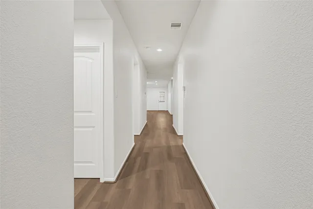 a view of a room with wooden floor and stairs