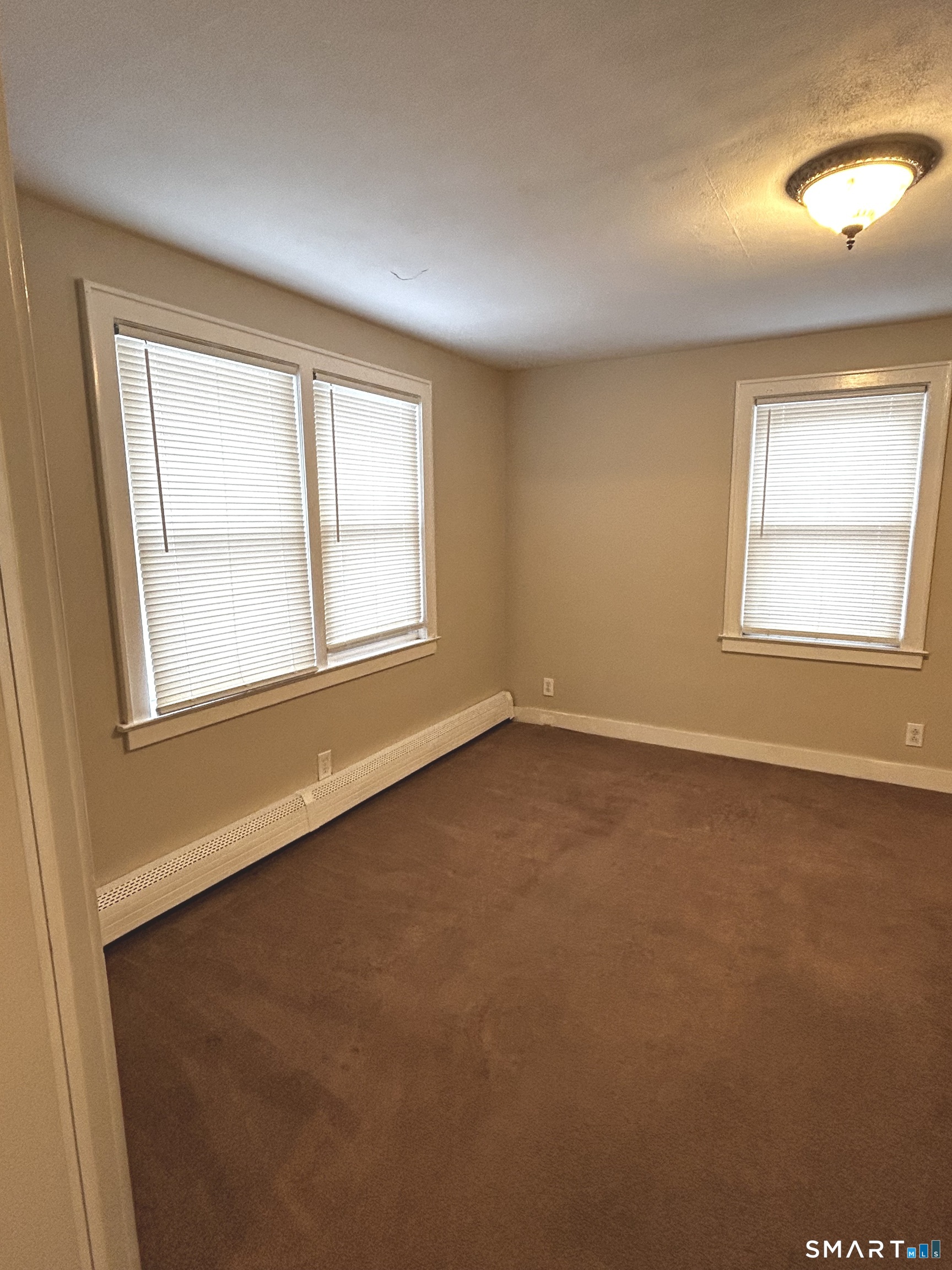 565 Main Street Southington, CT 06489 - Photo 11 of 14 an empty room with a window