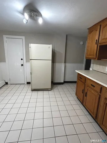 a kitchen with stainless steel appliances a refrigerator sink and cabinets