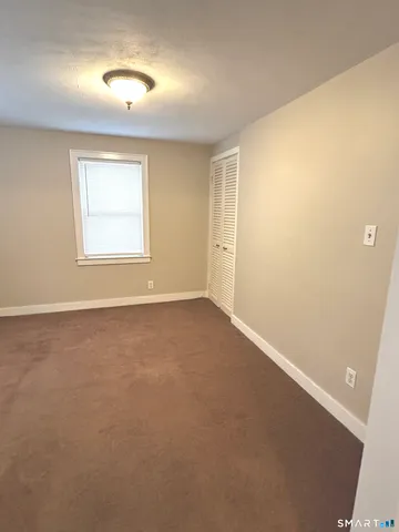 an empty room with a empty space and windows
