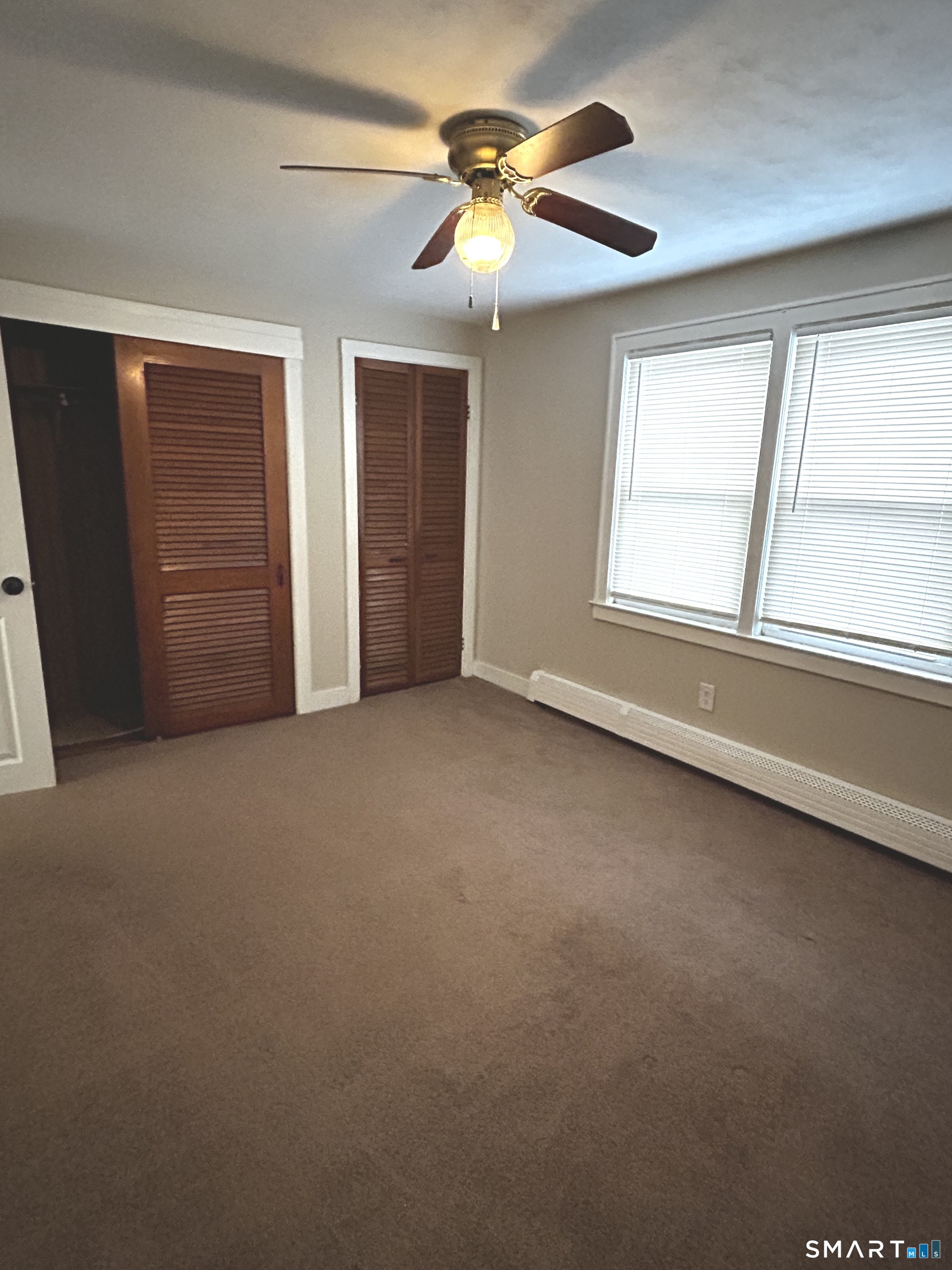 565 Main Street Southington, CT 06489 - Photo 10 of 14 a view of an empty room with a window