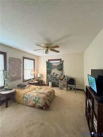 a bedroom with furniture and a bed