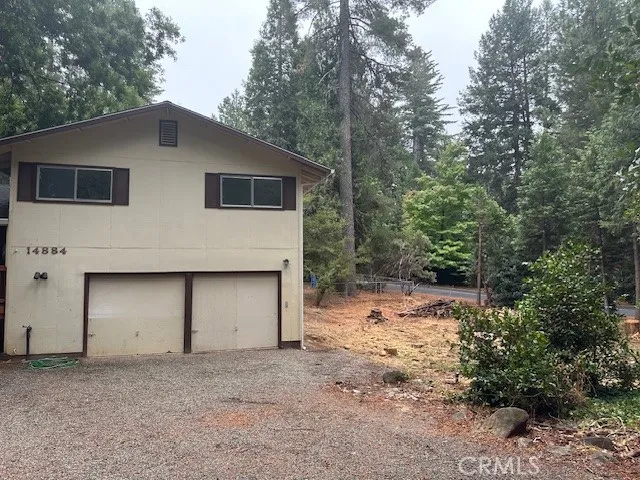 a house with trees in the background