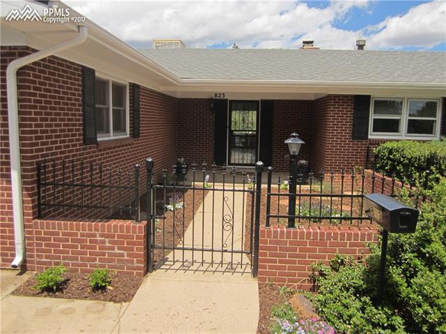 823 Cresta Road Colorado Springs, CO 80905 - Photo 3 of 36 Enclosed courtyard area with classic iron gate.