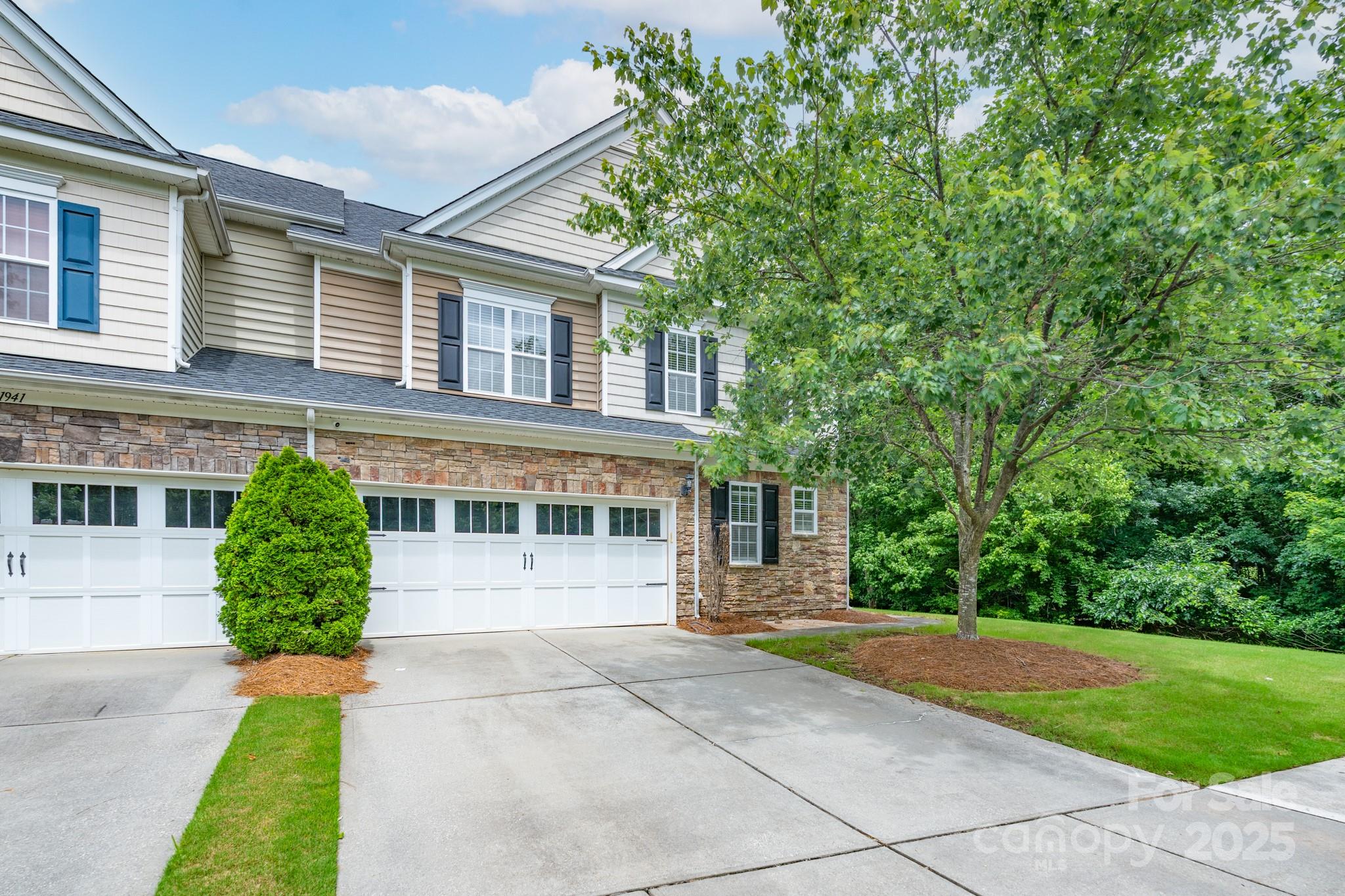 11945 Red Rust Lane Charlotte, NC 28277 - Photo 1 of 41 a front view of a house with a yard and potted plants