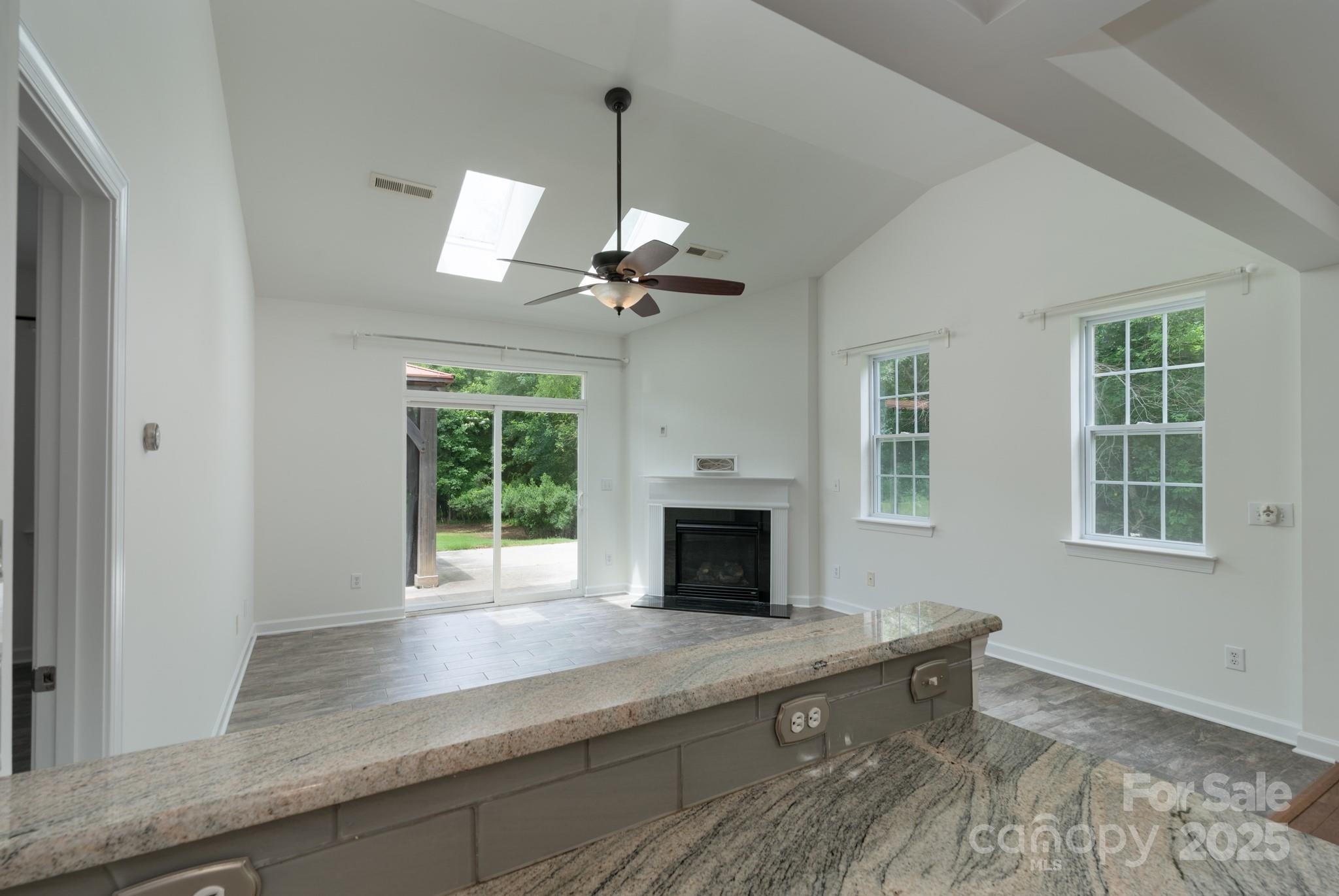 11945 Red Rust Lane Charlotte, NC 28277 - Photo 12 of 41 a living room with furniture and a fireplace