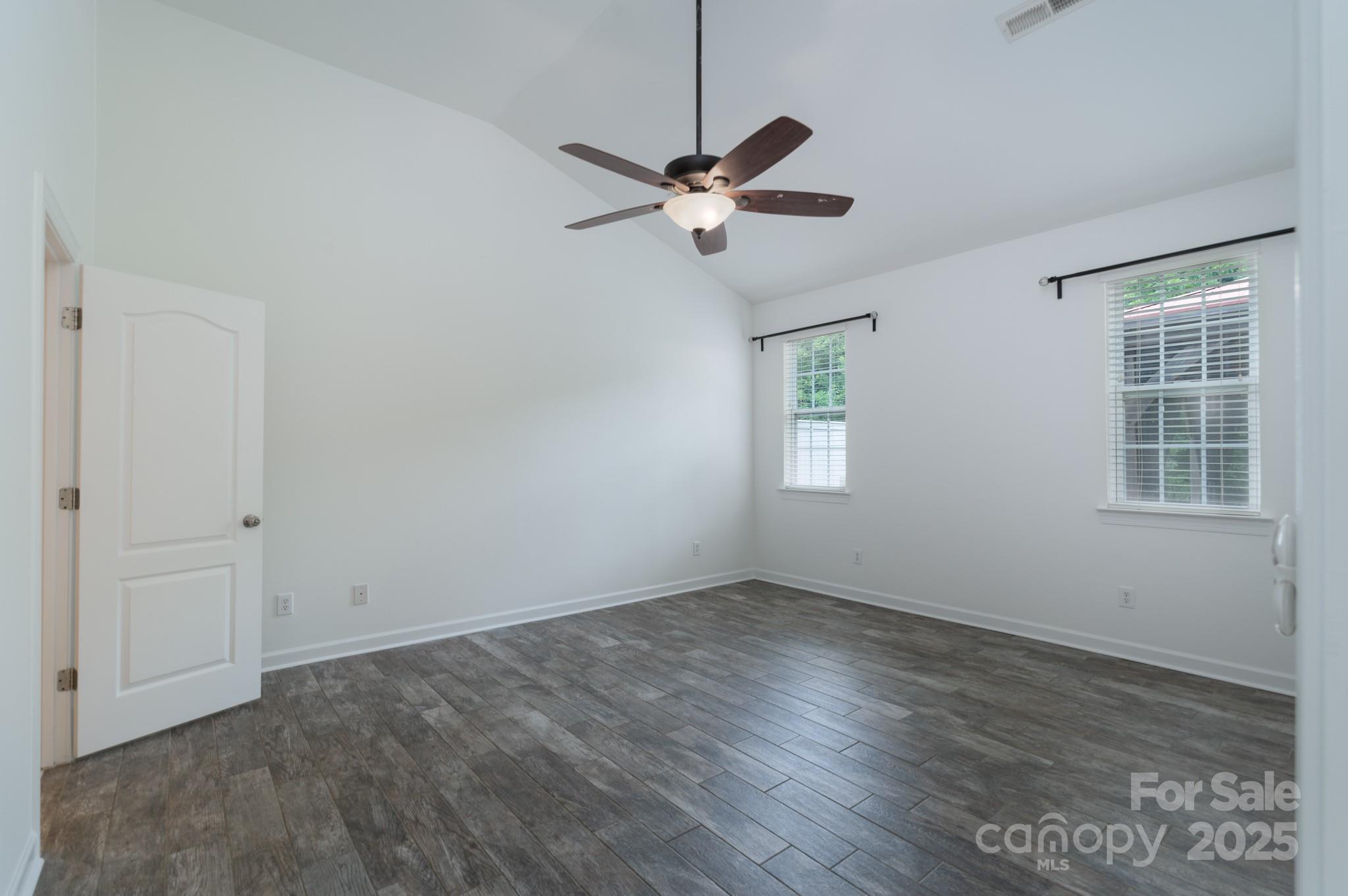 11945 Red Rust Lane Charlotte, NC 28277 - Photo 15 of 41 a view of a room with wooden floor and windows