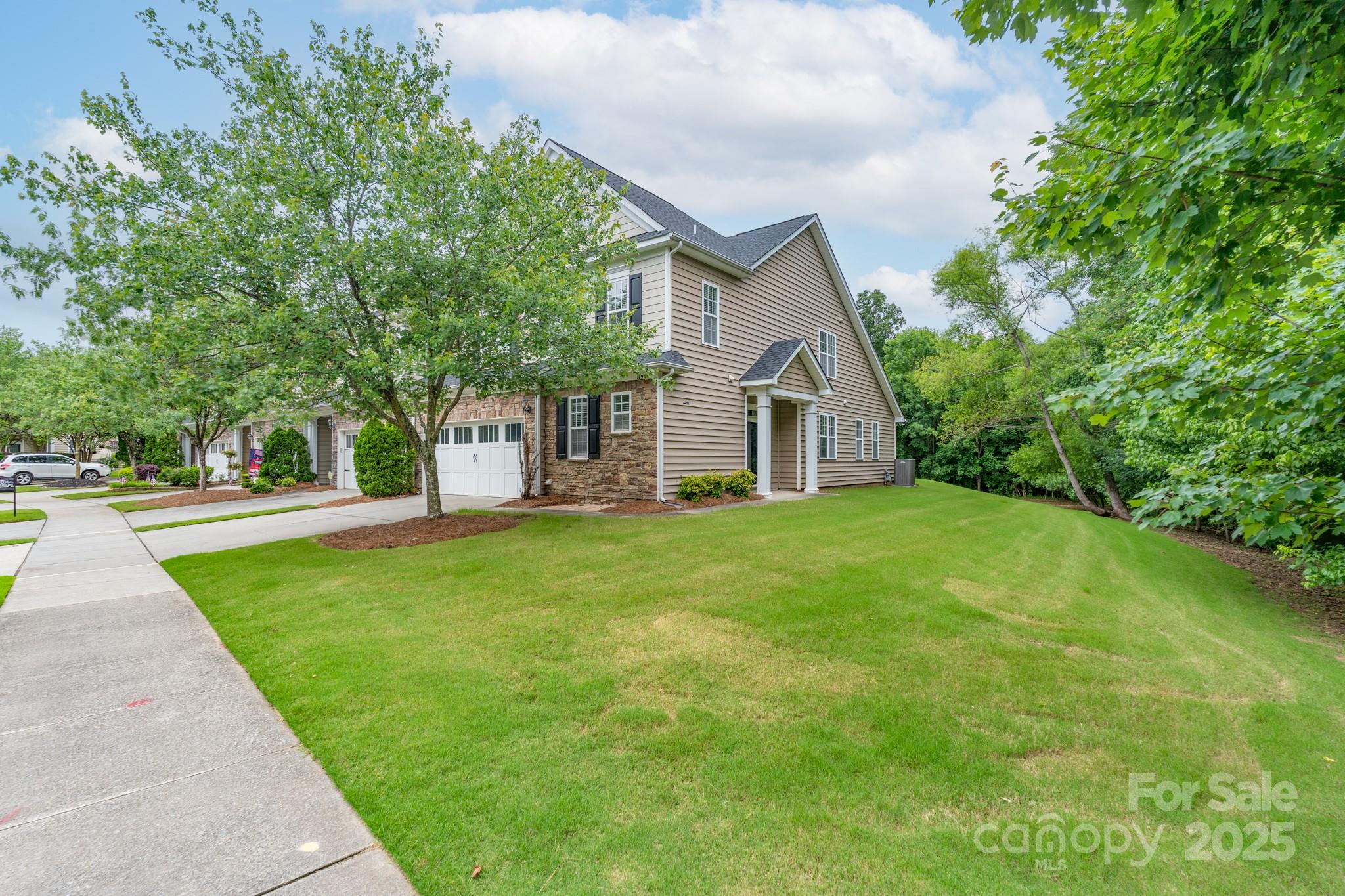 11945 Red Rust Lane Charlotte, NC 28277 - Photo 2 of 41 a front view of a house with yard and green space