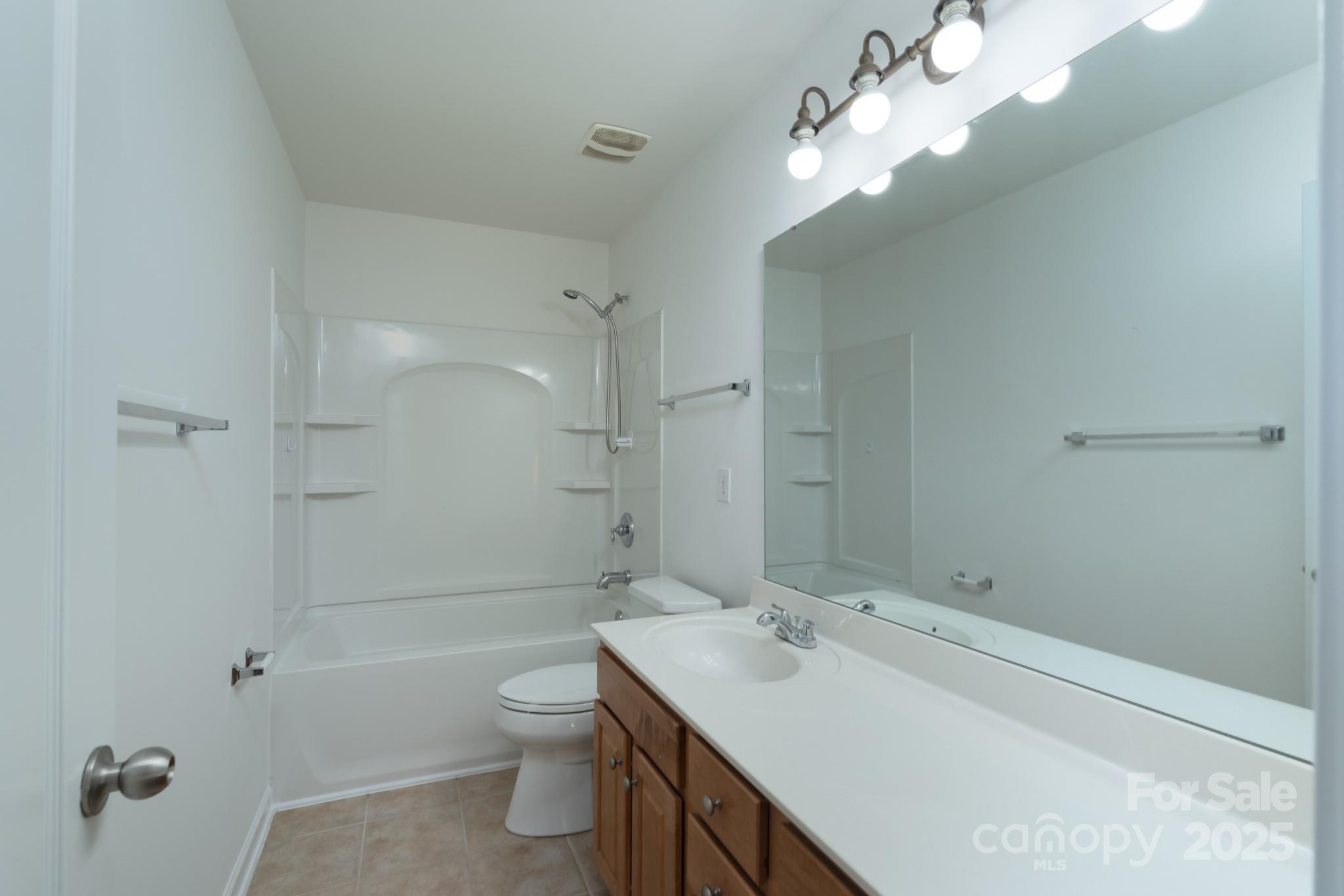 11945 Red Rust Lane Charlotte, NC 28277 - Photo 23 of 41 a bathroom with a double vanity sink toilet and shower