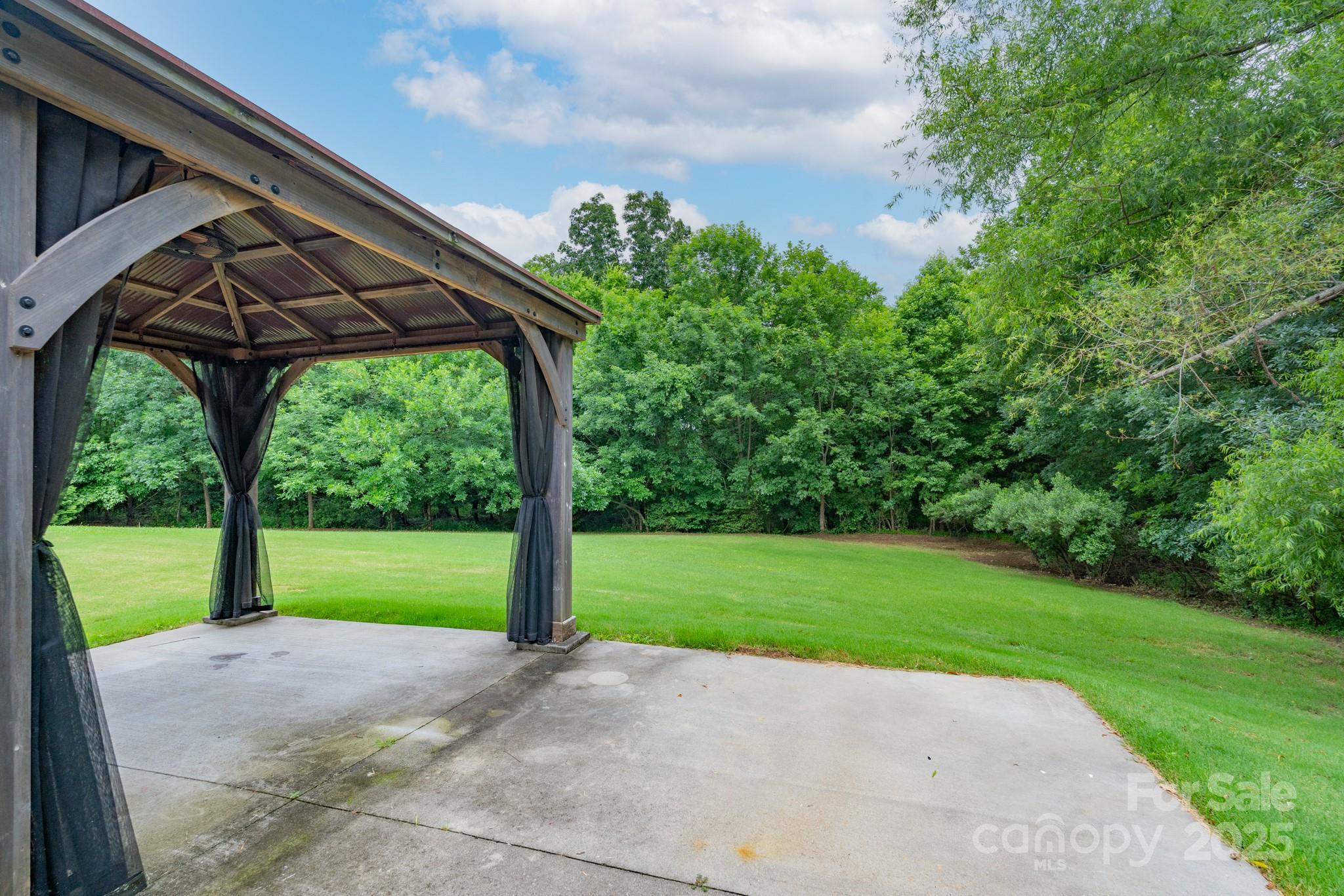 11945 Red Rust Lane Charlotte, NC 28277 - Photo 34 of 41 a view of a yard with porch and garden