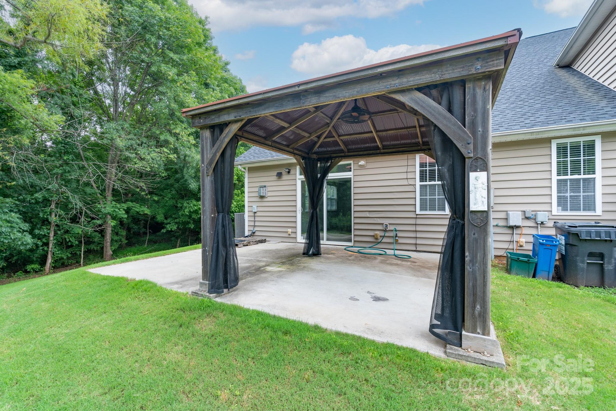 11945 Red Rust Lane Charlotte, NC 28277 - Photo 35 of 41 a view of backyard with a barn and large trees
