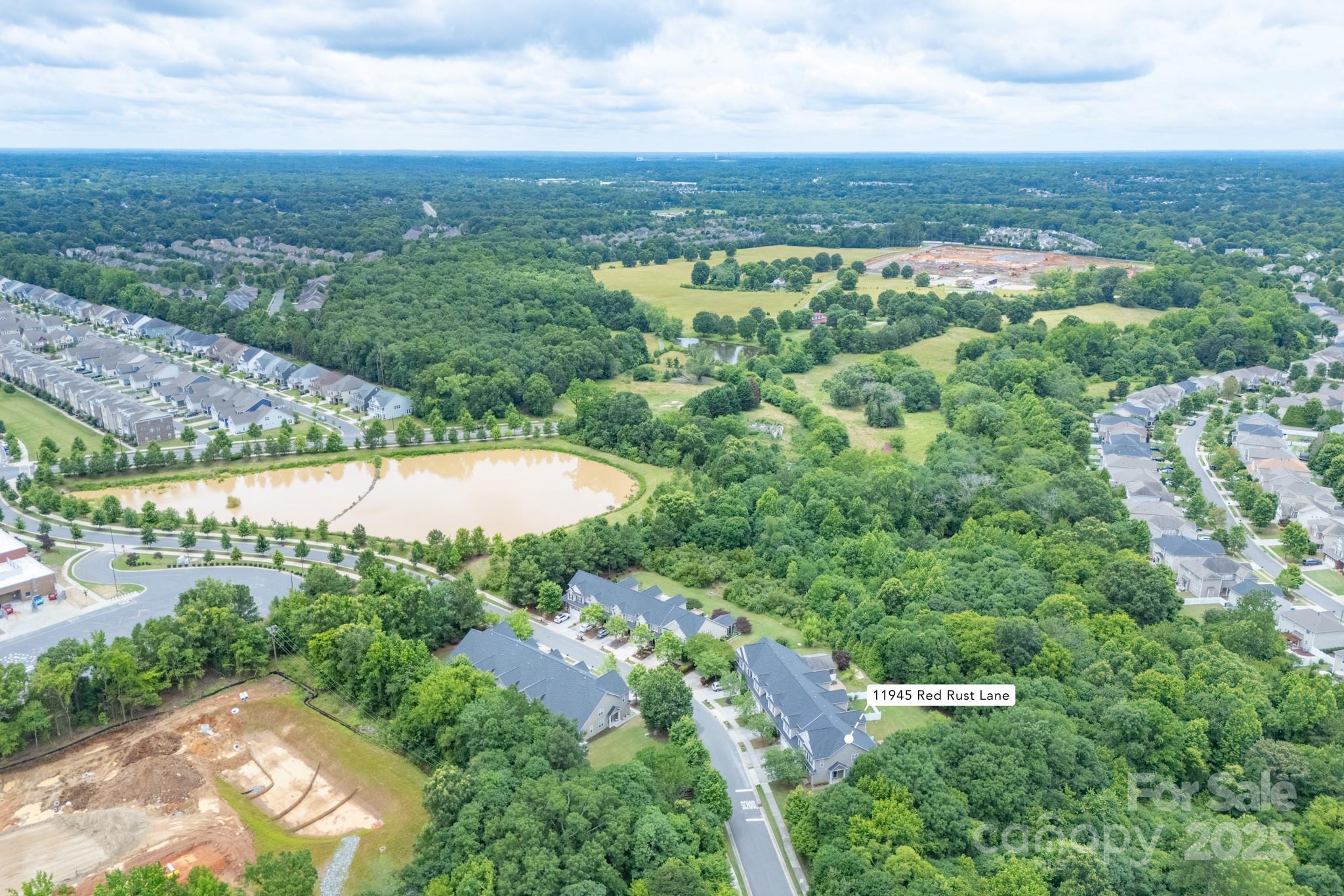 11945 Red Rust Lane Charlotte, NC 28277 - Photo 40 of 41 an aerial view of residential houses with outdoor space and trees