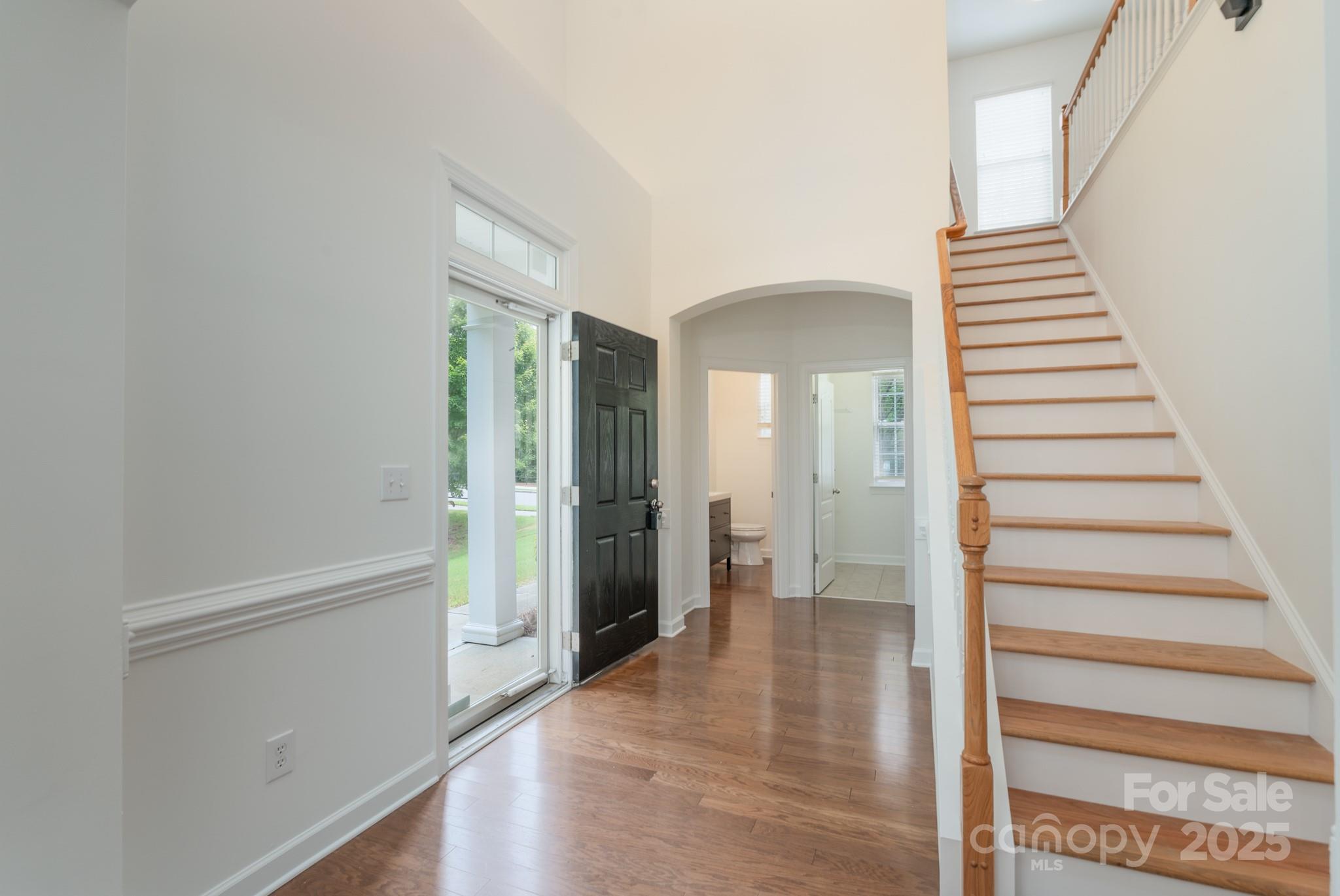 11945 Red Rust Lane Charlotte, NC 28277 - Photo 5 of 41 a view of a hallway with wooden floor and entryway