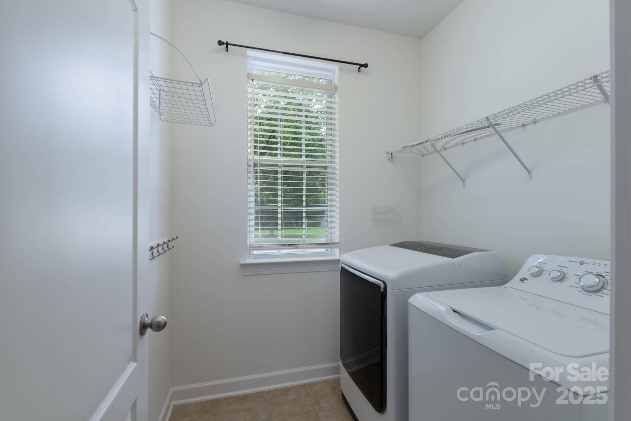 11945 Red Rust Lane Charlotte, NC 28277 - Photo 7 of 41 a utility room with dryer and washer