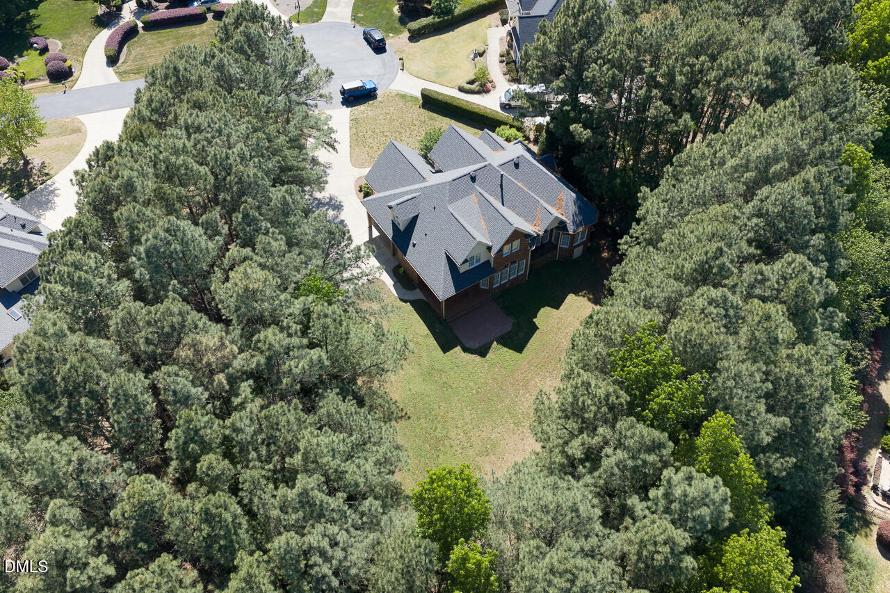4004 Frontenac Court Apex, NC 27539 - Photo 59 of 61 an aerial view of a house with a yard