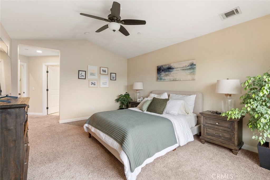 55 8th Street Templeton, CA 93465 - Photo 15 of 33 a spacious bedroom with a bed and a potted plant