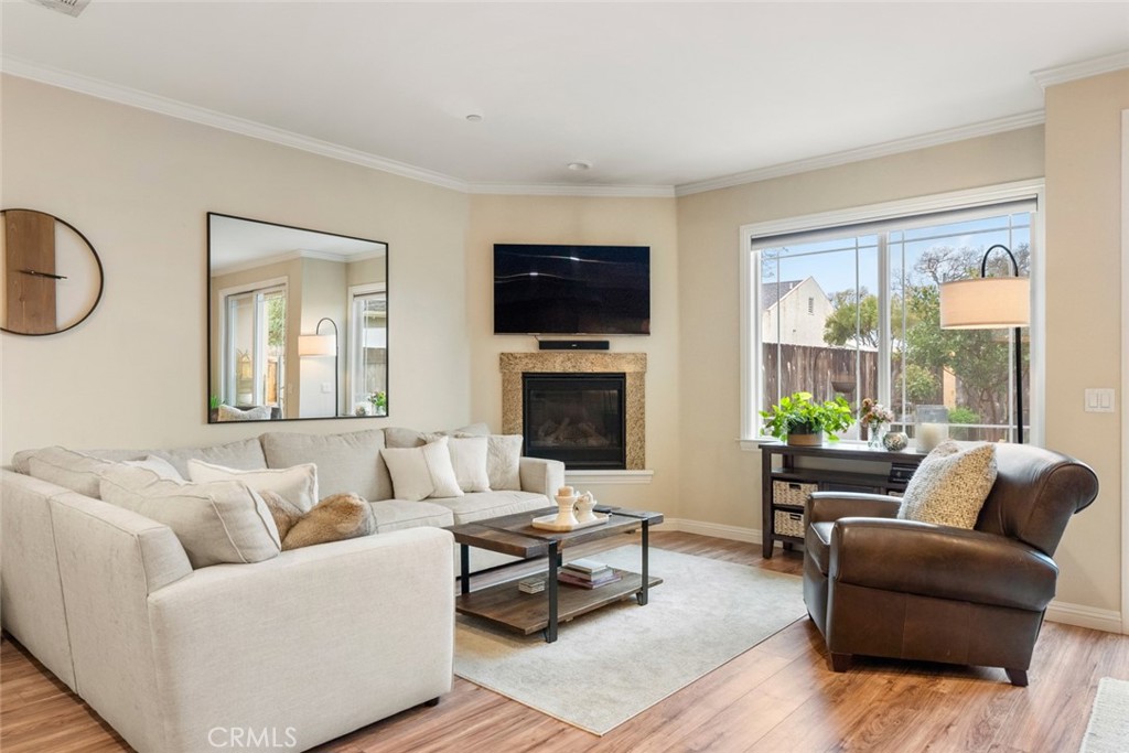 55 8th Street Templeton, CA 93465 - Photo 7 of 33 a living room with furniture a flat screen tv and a fireplace