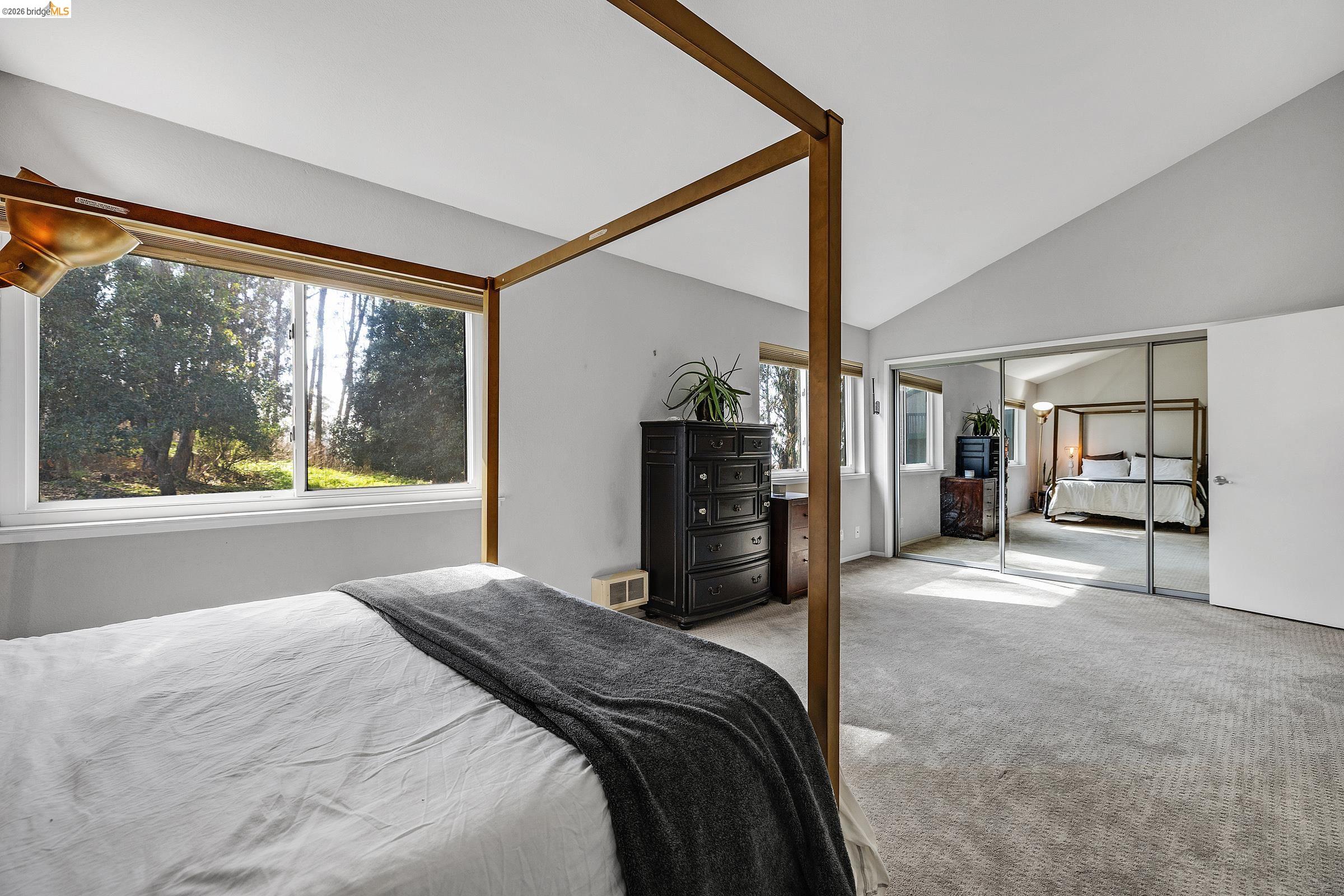 407 Vista Heights Road El Cerrito, CA 94530 - Photo 17 of 29 Carpeted bedroom featuring a closet and lofted ceiling
