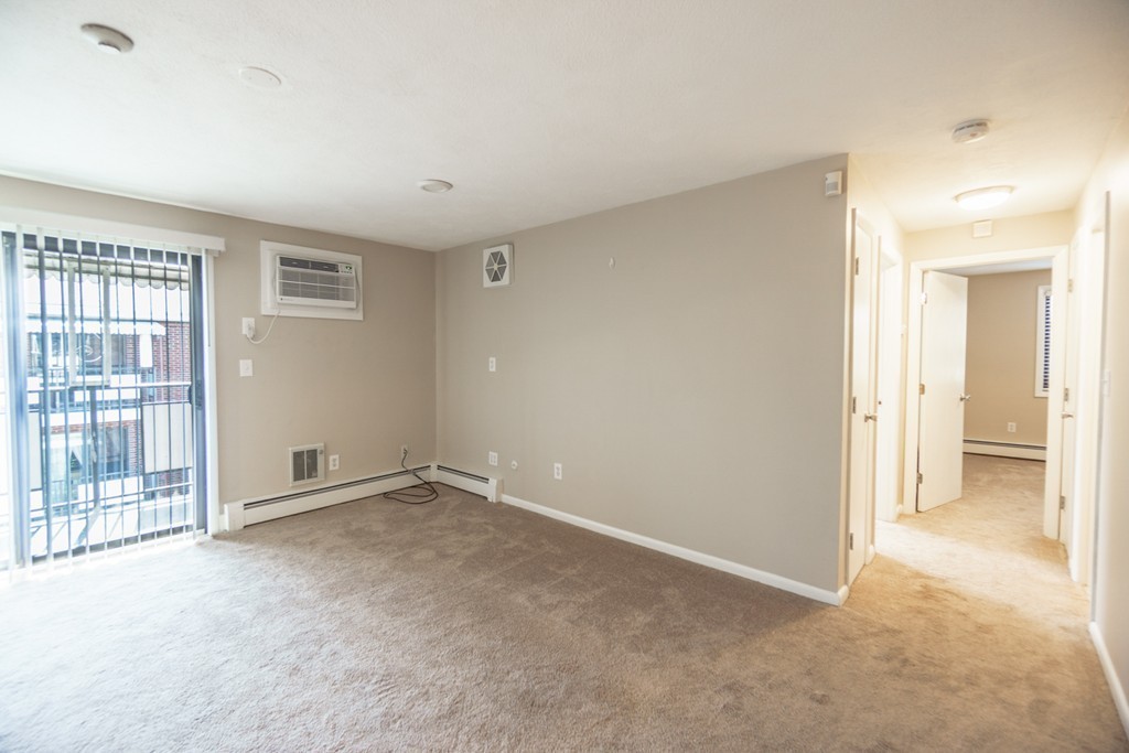 50 Colonial Drive, Unit 8 Andover, MA 01810 - Photo 11 of 25 a view of an empty room with a window