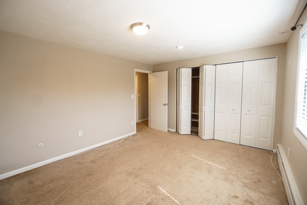 50 Colonial Drive, Unit 8 Andover, MA 01810 - Photo 14 of 25 a view of an empty room with a window