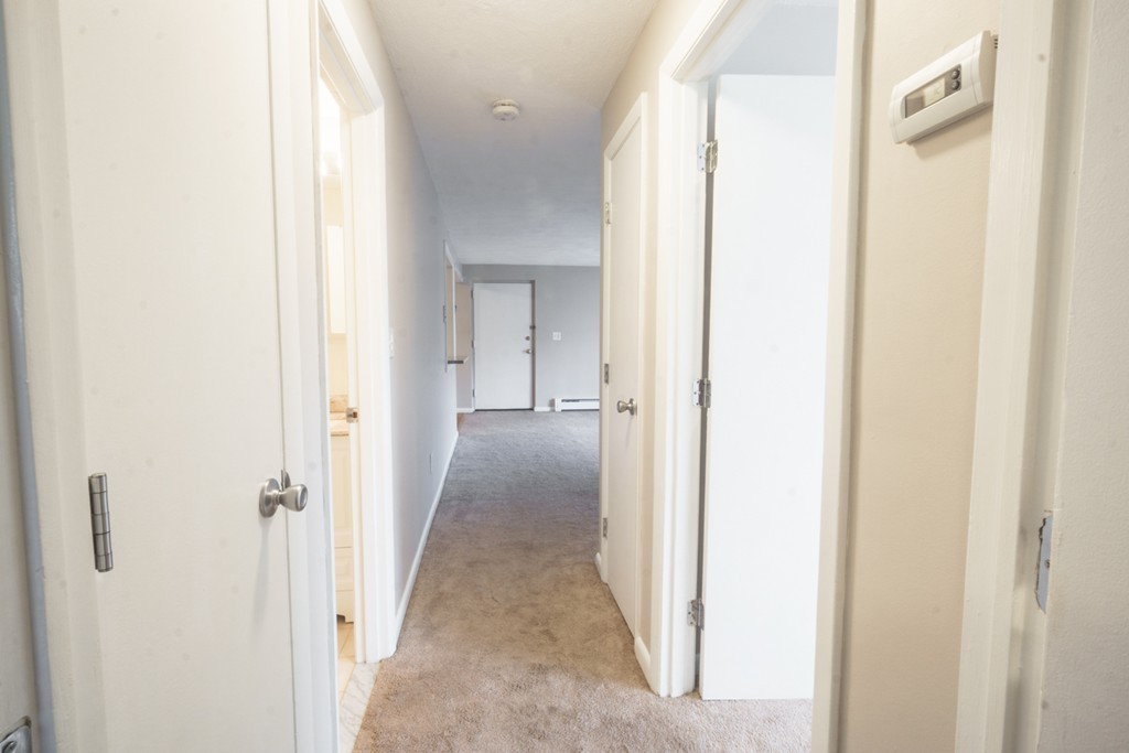 50 Colonial Drive, Unit 8 Andover, MA 01810 - Photo 15 of 25 a view of a hallway with wooden floor