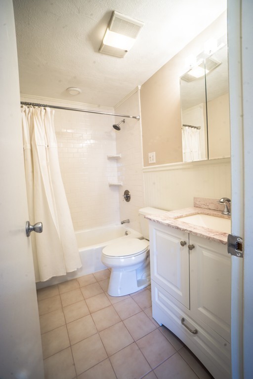 50 Colonial Drive, Unit 8 Andover, MA 01810 - Photo 18 of 25 a bathroom with a sink toilet and shower