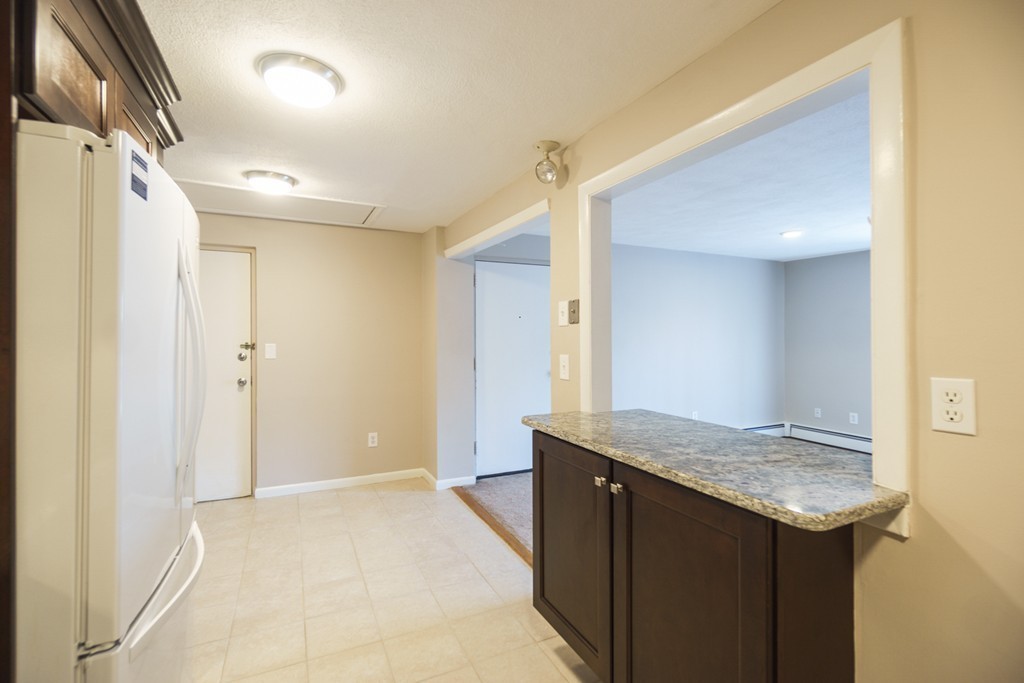 50 Colonial Drive, Unit 8 Andover, MA 01810 - Photo 3 of 25 a view of bathroom with a sink and mirror