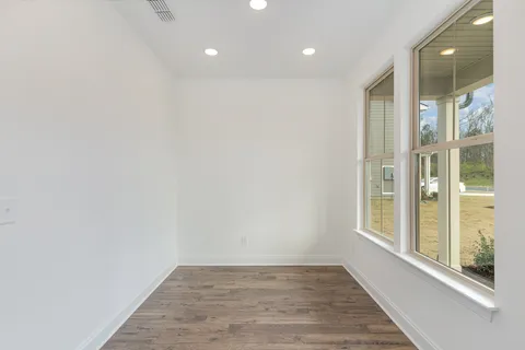 a view of a living room with wooden floor