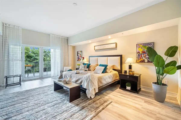 a bedroom with furniture and a wooden floor